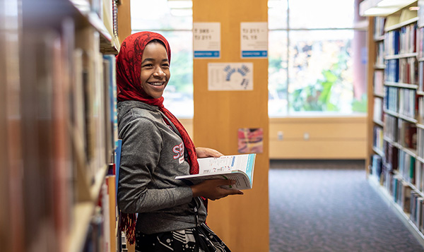 Student reading in the South Seattle College library