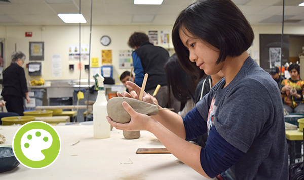  Ceramics student working with clay  