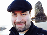Brandon Sturm, smiling with beach in the background