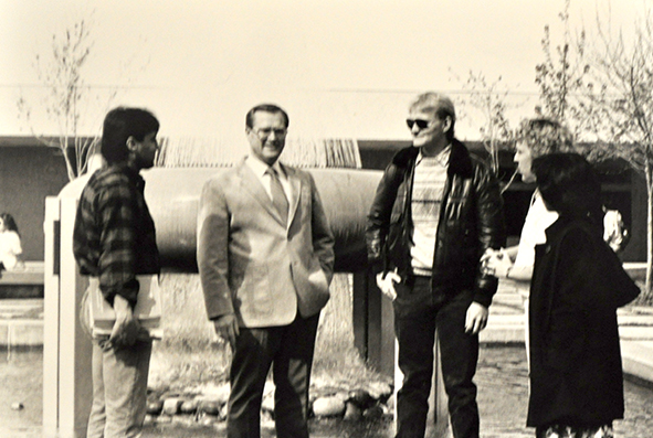 Jerry Brockey with students in the Robert Smith Building courtyard. 
