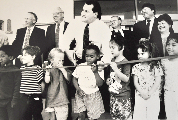 Jerry Brockey and students from the Child Care Center celebrating the opening of the Jerry Brockey Student Center.